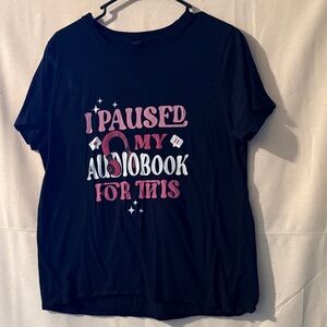 Gildan Black  Tee with Pink and White Text it is a smaller larger . It shrunk